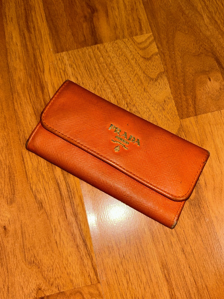 Authentic Prada Orange Saffiano Fold-Over Key Wallet With Gold Logo